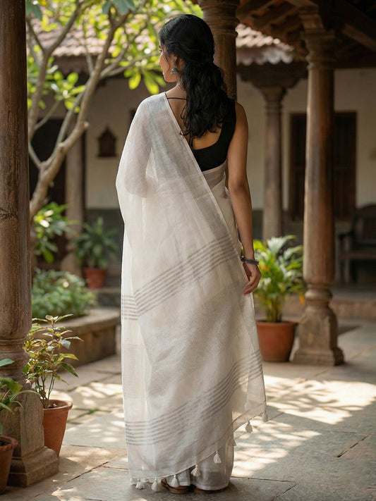 Sutriti Elegant White Woven Linen Saree with Contrast Zari Border & Tassels – Soft & Breathable Party Wear