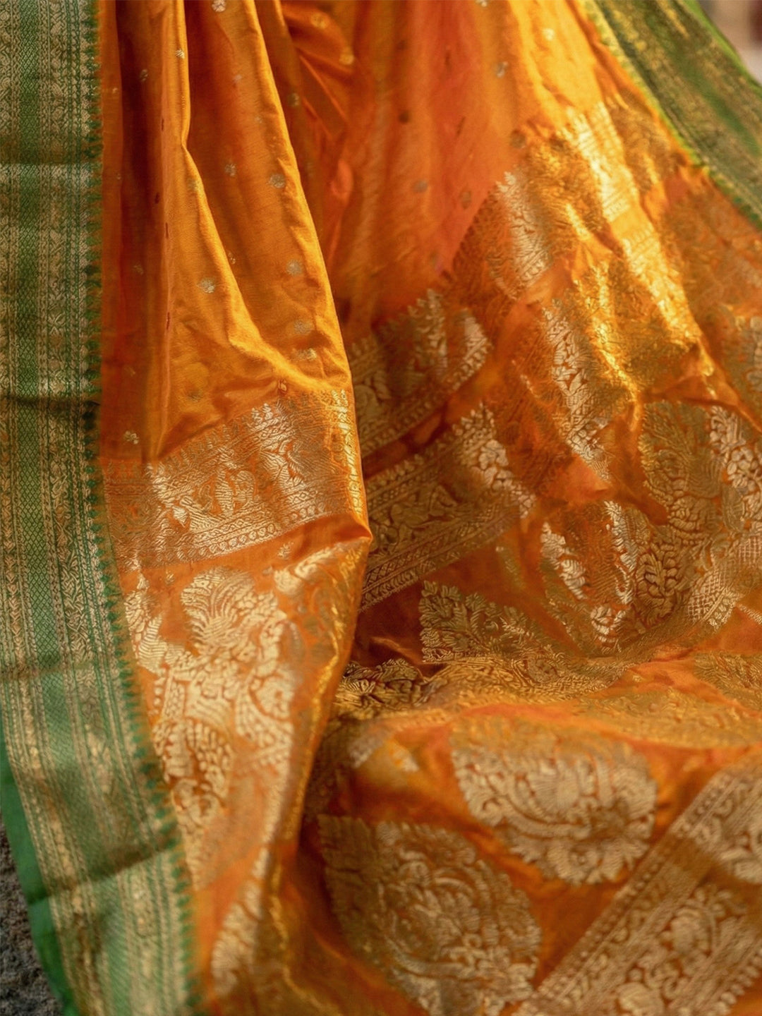 Orange woven zari border silk blend saree for women with butti design and blouse piece