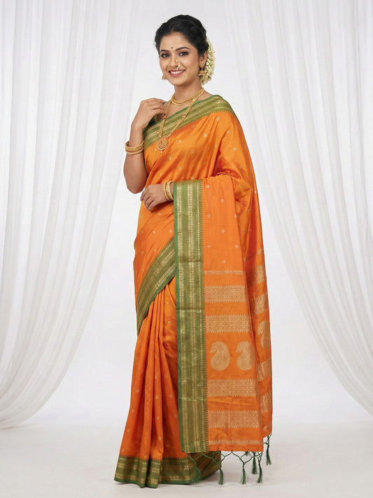 Sutriti The Sunset Glow: Vibrant Orange Soft Silk Saree with Contrast Green Zari Border