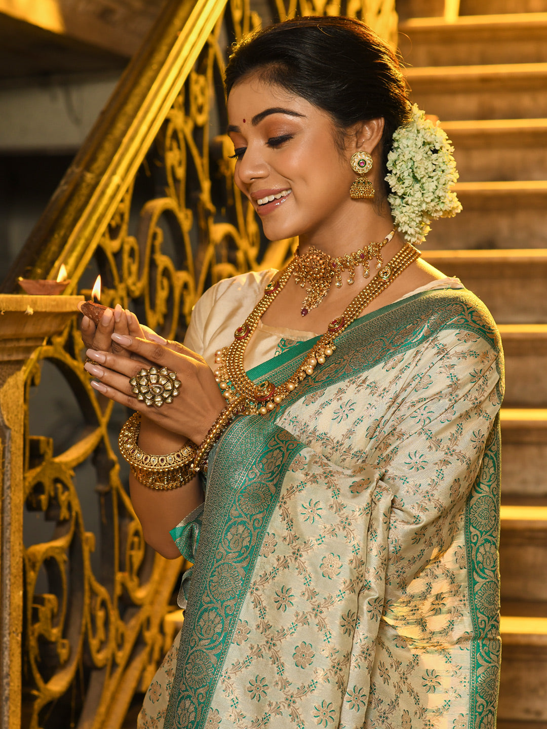 Sutriti Ivory and Sea Green Banarasi Silk Saree with Golden Zari – Regal Elegance for Timeless Celebrations
