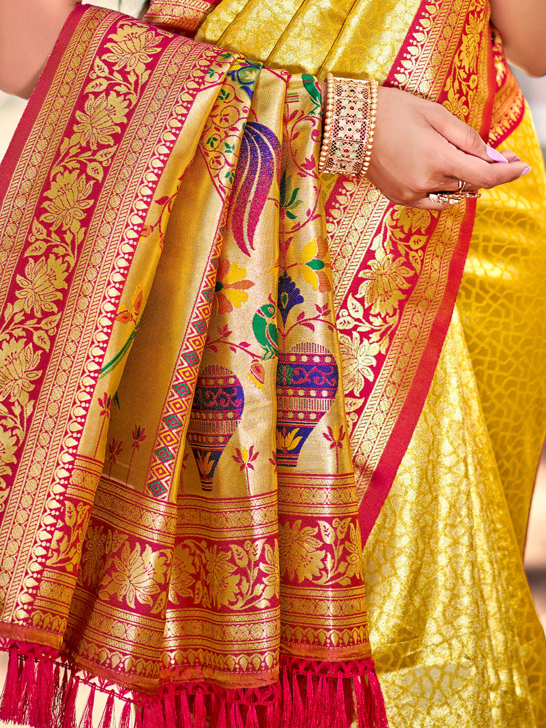 Sutriti Traditional Yellow Kanjivaram Silk Saree with Rich Red Border and Peacock Pallu Design