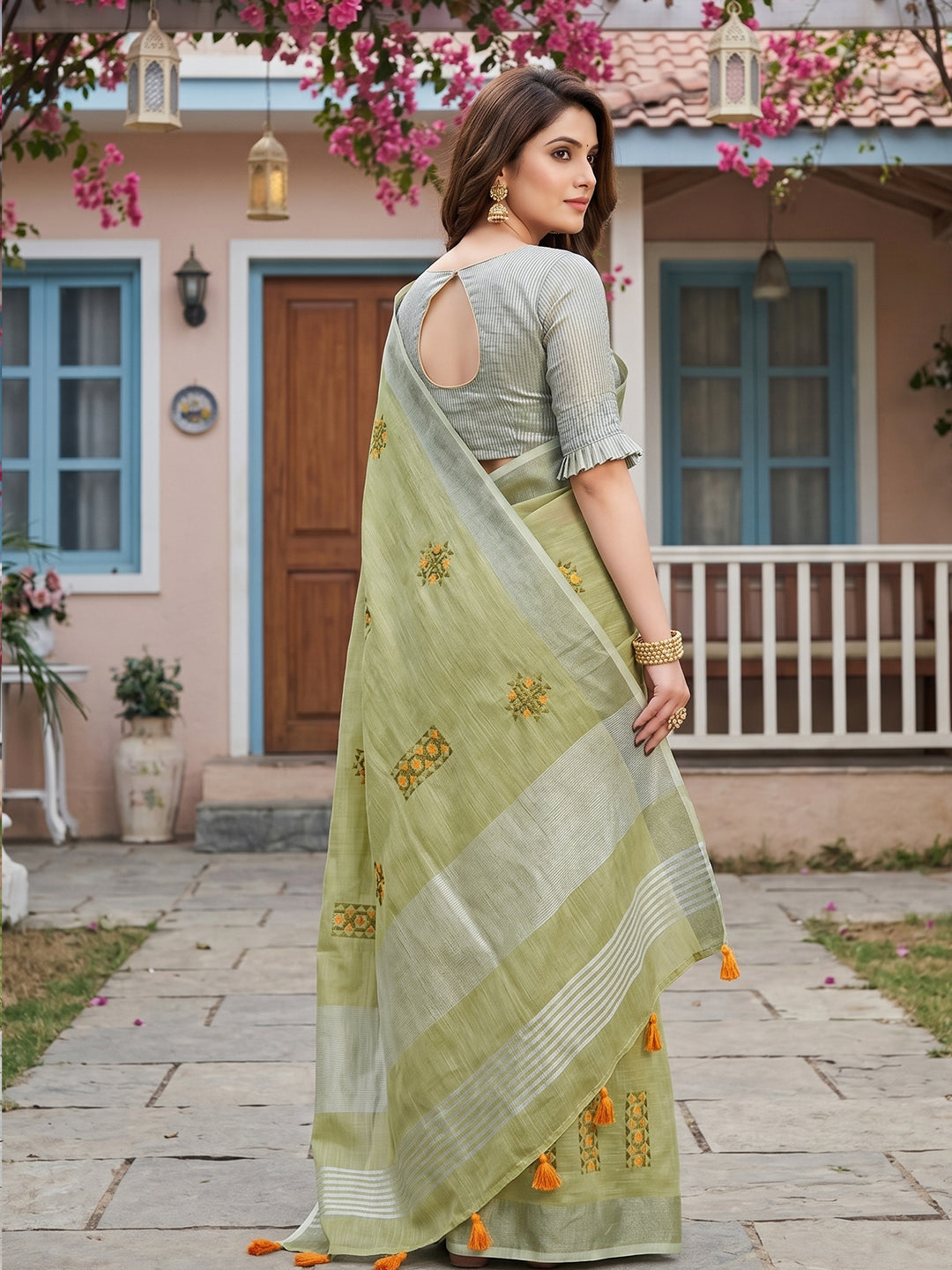 Sutriti Women Light Green Linen Saree with Floral Embroidery Border & Tassels
