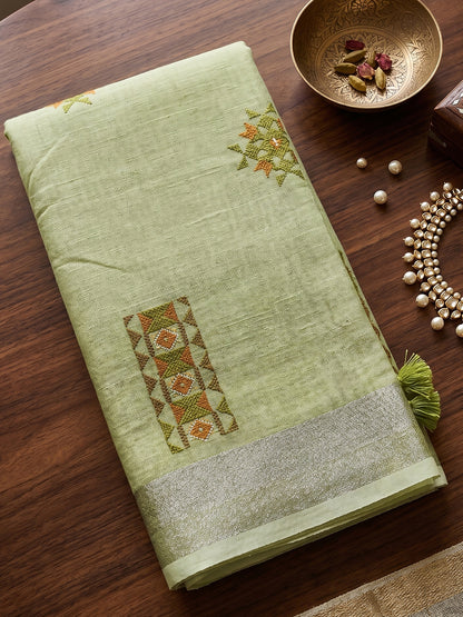 Sutriti Women Light Green Linen Saree with Floral Embroidery Border & Tassels