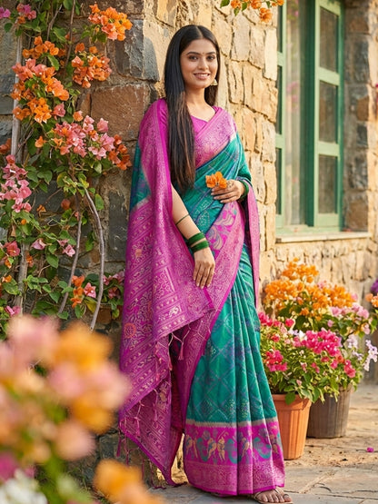 Teal green woven saree for women with magenta contrast border and rich pallu