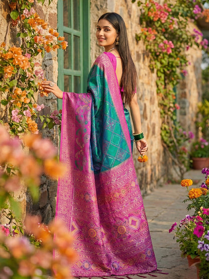 Teal green woven saree for women with magenta contrast border and rich pallu