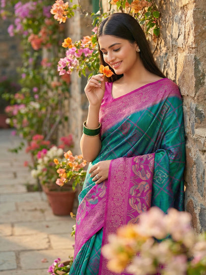 Teal green woven saree for women with magenta contrast border and rich pallu
