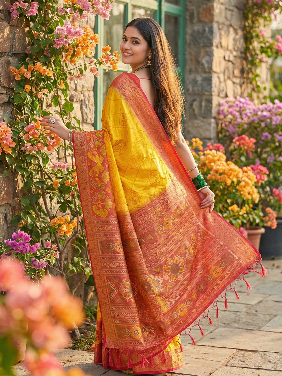 Mustard yellow woven saree with rust orange contrast border and rich pallu for festive wear
