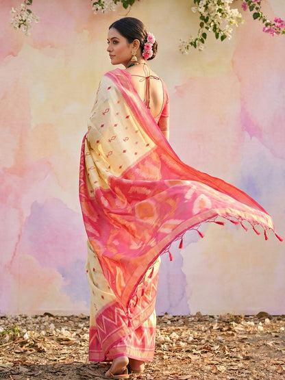 Ivory cream woven saree for women with pink contrast border and tassel pallu