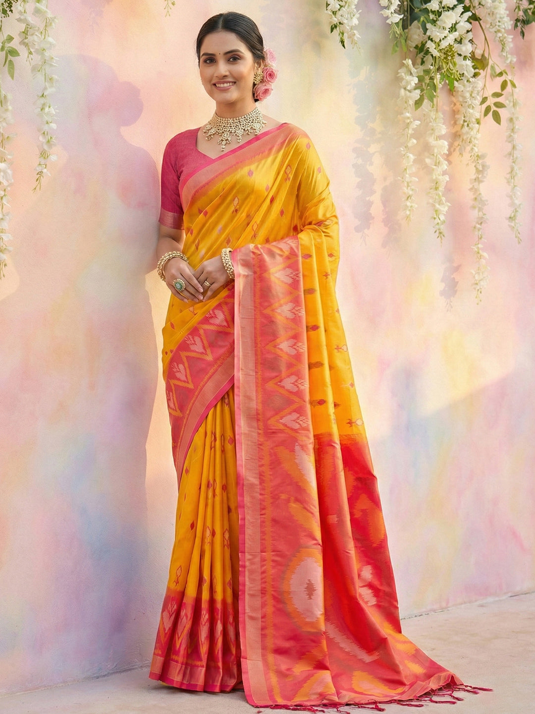 Mustard yellow woven saree with pink contrast border and rich pallu for festive wear