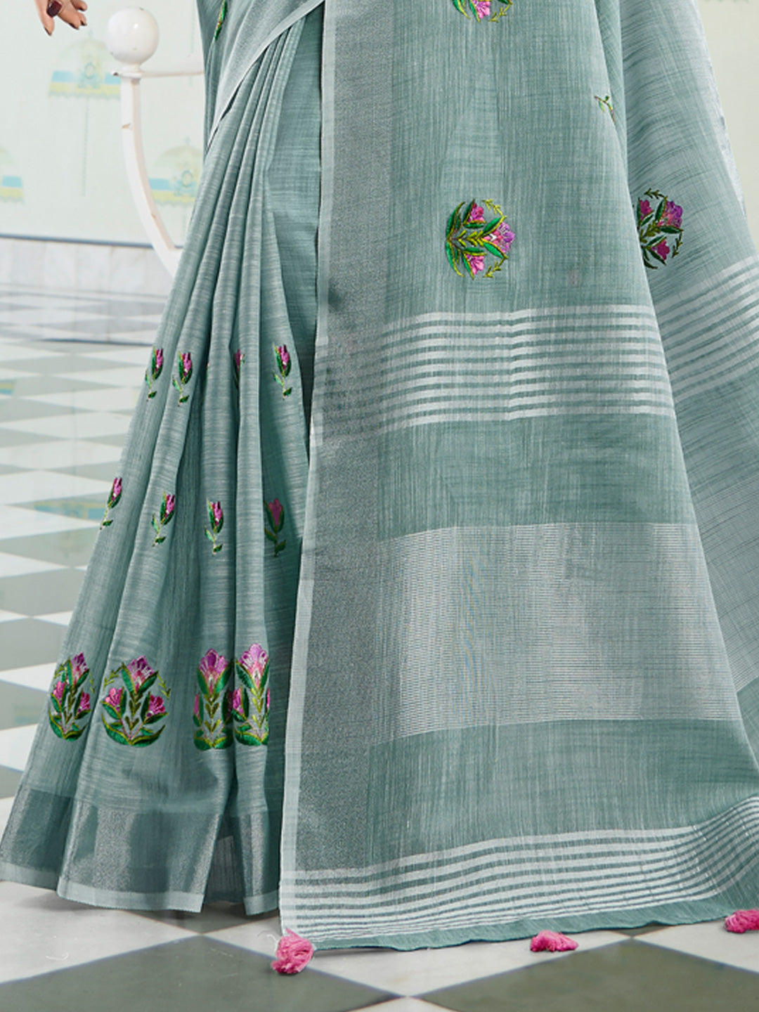Sutriti Women Sea Green Linen Saree with Floral Embroidery Border & Tassels