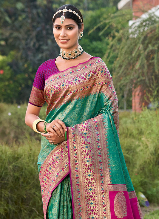 Emerald green zari woven saree for women with pink contrast border and heavy pallu
