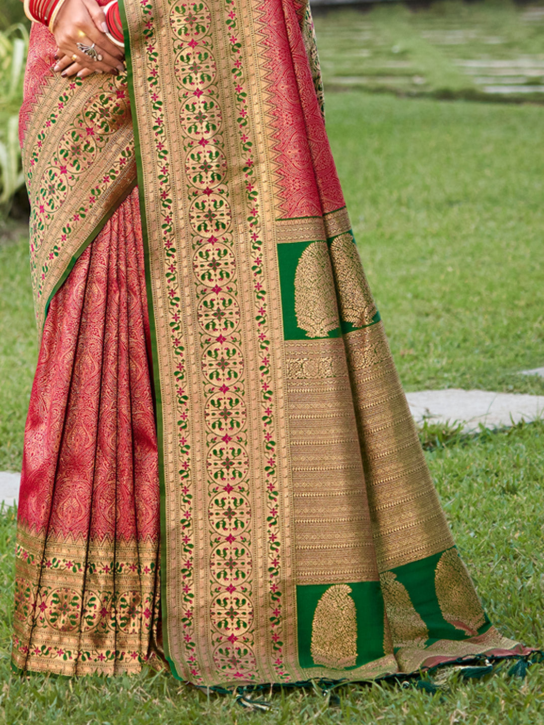 Rani pink zari woven saree for women with green contrast border and heavy pallu