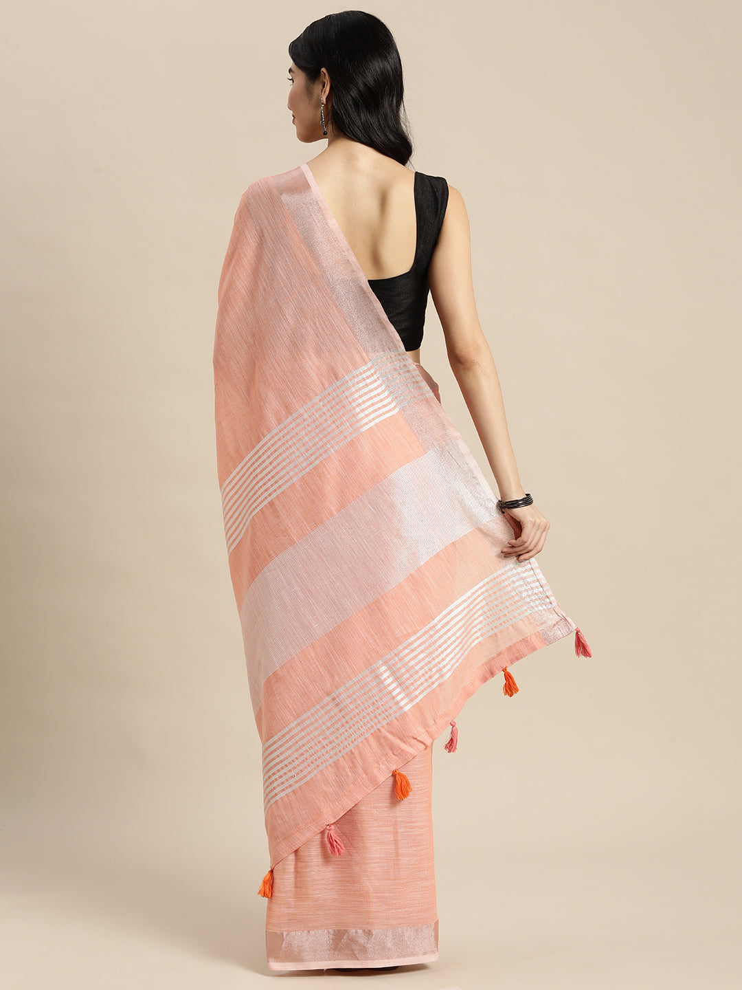 Sutriti Elegant Peach Woven Linen Saree with Contrast Zari Border & Tassels – Soft & Breathable Party Wear