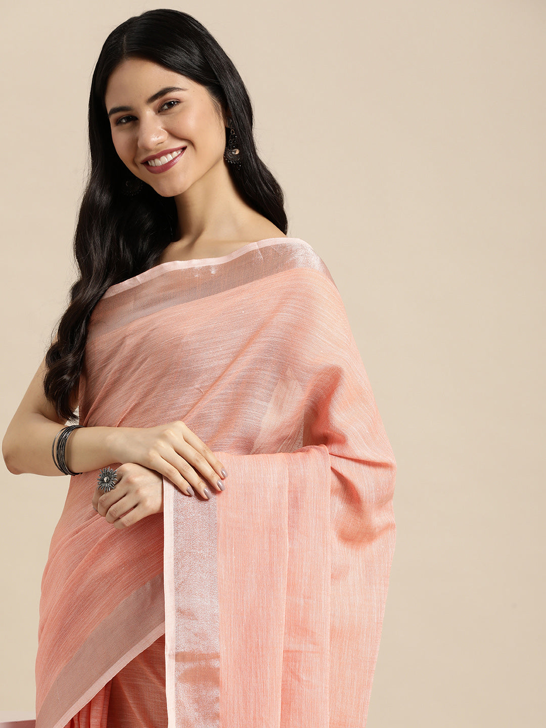 Sutriti Elegant Peach Woven Linen Saree with Contrast Zari Border & Tassels – Soft & Breathable Party Wear