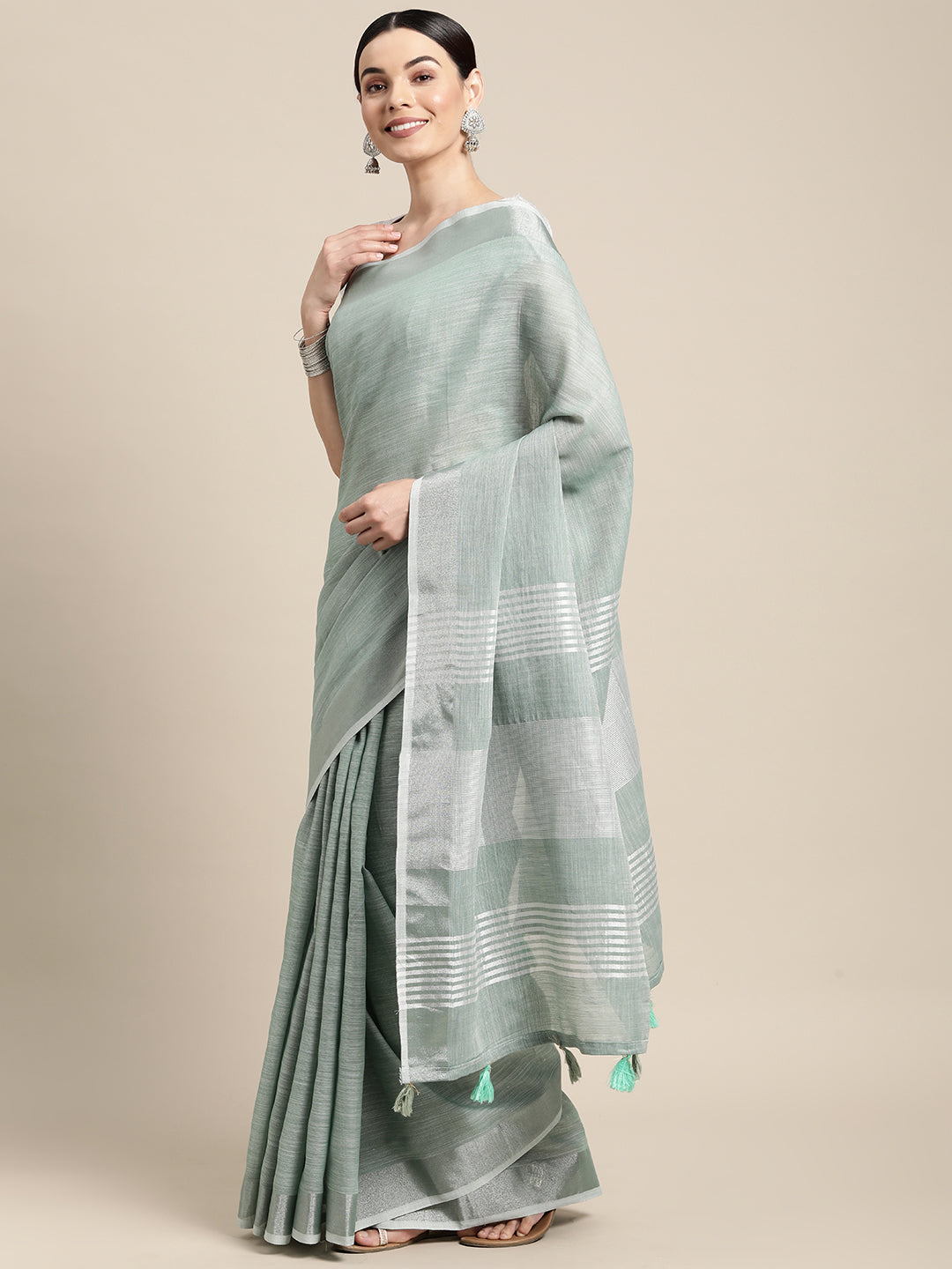 Sutriti Elegant Sea Green Woven Linen Saree with Contrast Zari Border & Tassels – Soft & Breathable Party Wear