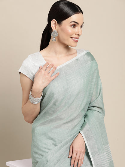 Sutriti Elegant Sea Green Woven Linen Saree with Contrast Zari Border & Tassels – Soft & Breathable Party Wear