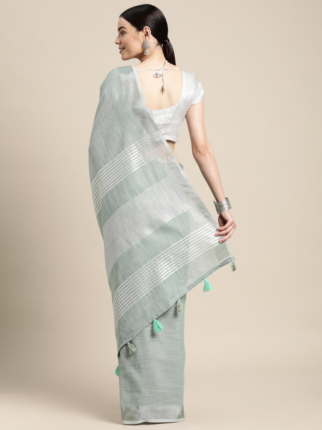 Sutriti Elegant Sea Green Woven Linen Saree with Contrast Zari Border & Tassels – Soft & Breathable Party Wear