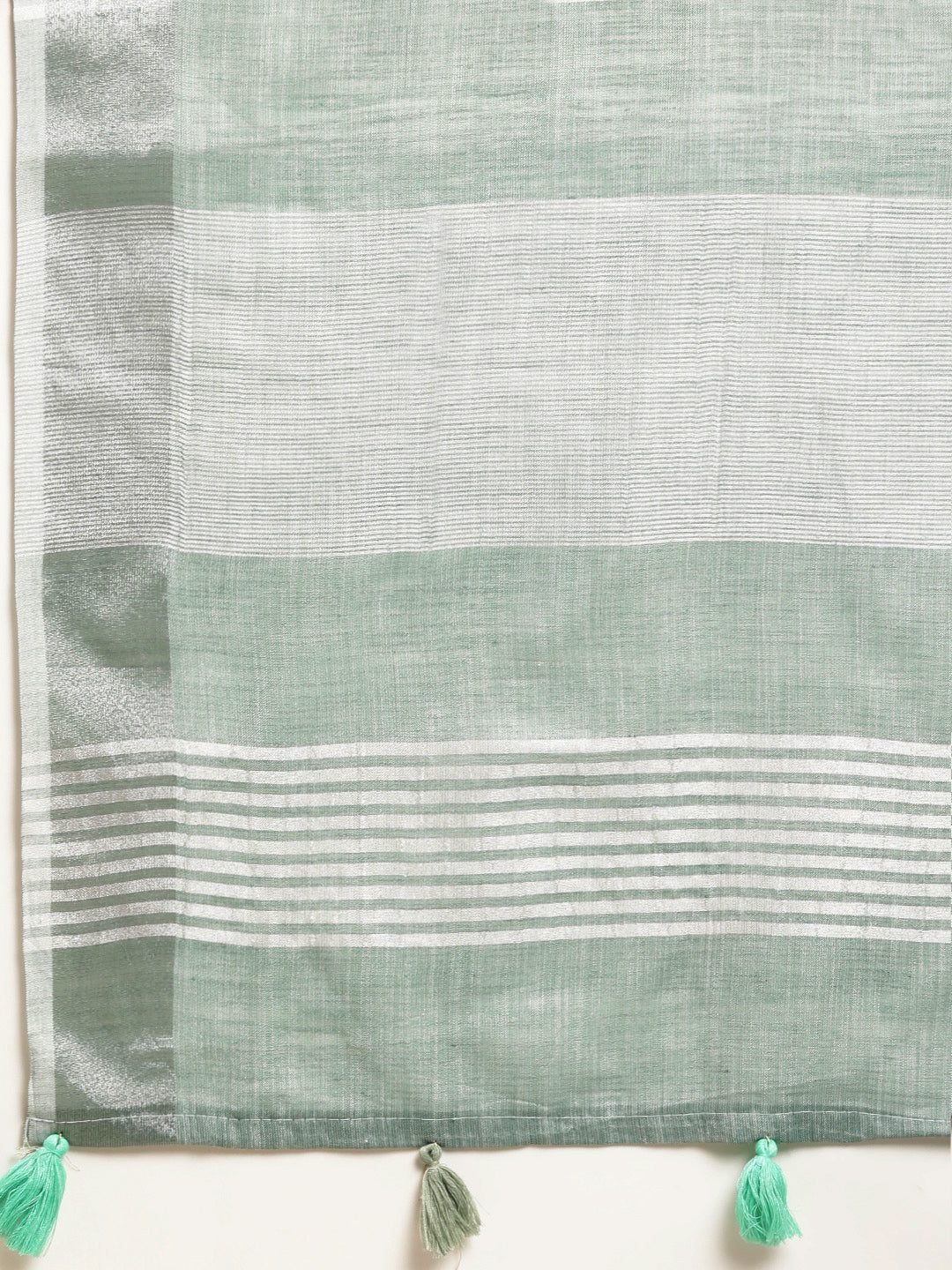Sutriti Elegant Sea Green Woven Linen Saree with Contrast Zari Border & Tassels – Soft & Breathable Party Wear