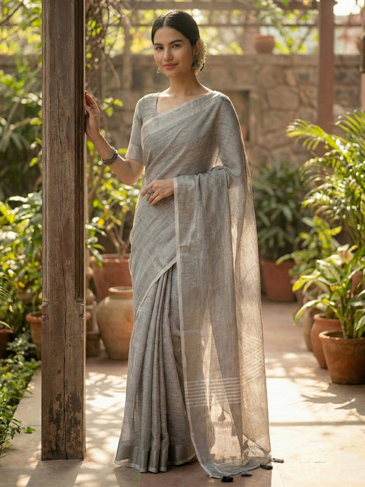 Sutriti Elegant Grey Woven Linen Saree with Contrast Zari Border & Tassels – Soft & Breathable Party Wear
