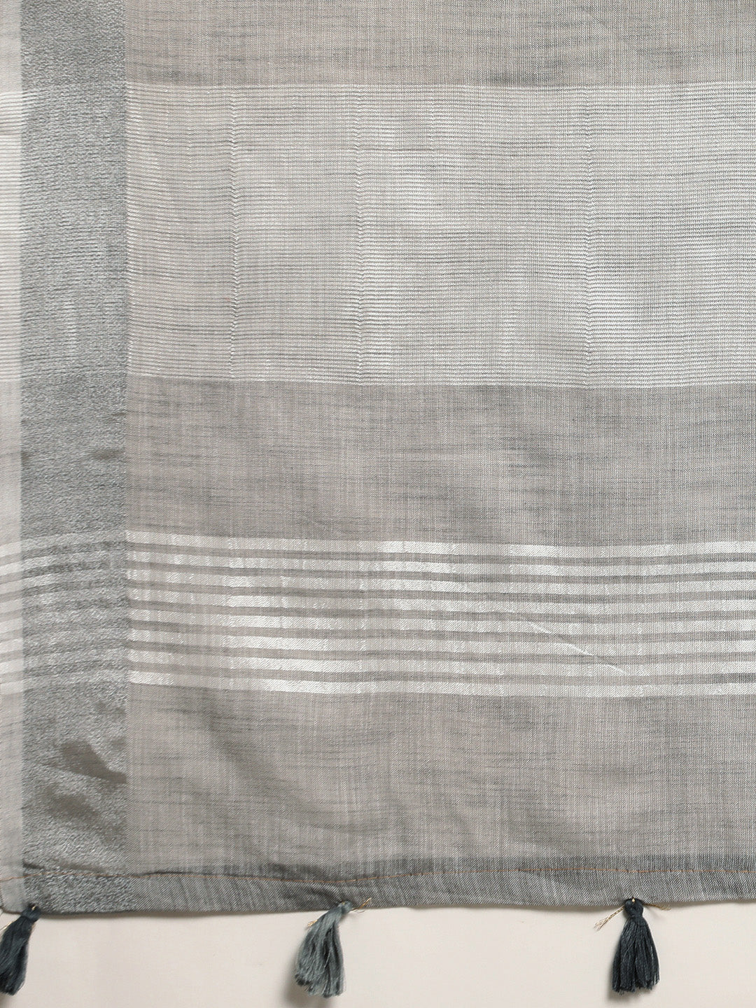 Sutriti Elegant Grey Woven Linen Saree with Contrast Zari Border & Tassels – Soft & Breathable Party Wear
