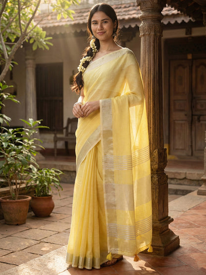 Sutriti Elegant Yellow Woven Linen Saree with Contrast Zari Border & Tassels – Soft & Breathable Party Wear