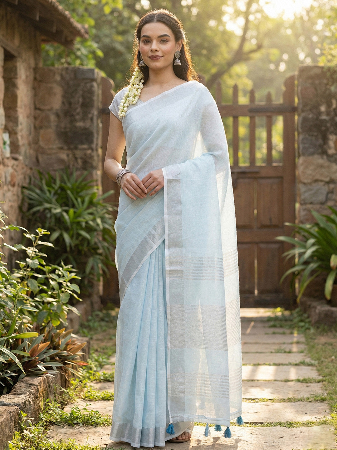 Sutriti Elegant Sky Blue Woven Linen Saree with Contrast Zari Border & Tassels – Soft & Breathable Party Wear