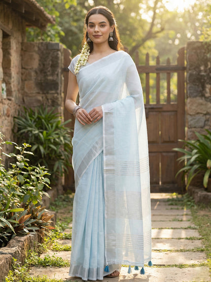 Sutriti Elegant Sky Blue Woven Linen Saree with Contrast Zari Border & Tassels – Soft & Breathable Party Wear