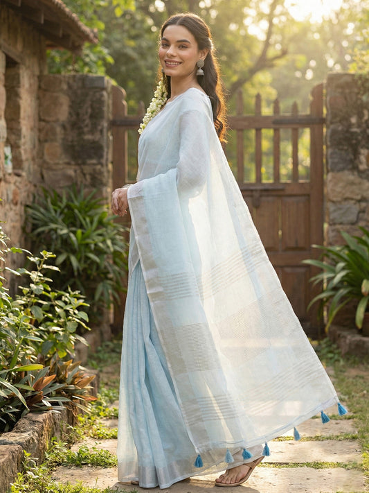 Sutriti Elegant Sky Blue Woven Linen Saree with Contrast Zari Border & Tassels – Soft & Breathable Party Wear