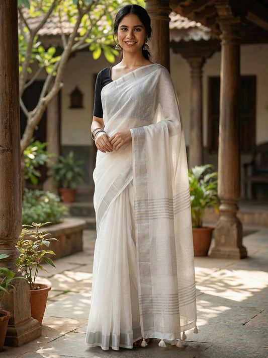 Sutriti Elegant White Woven Linen Saree with Contrast Zari Border & Tassels – Soft & Breathable Party Wear