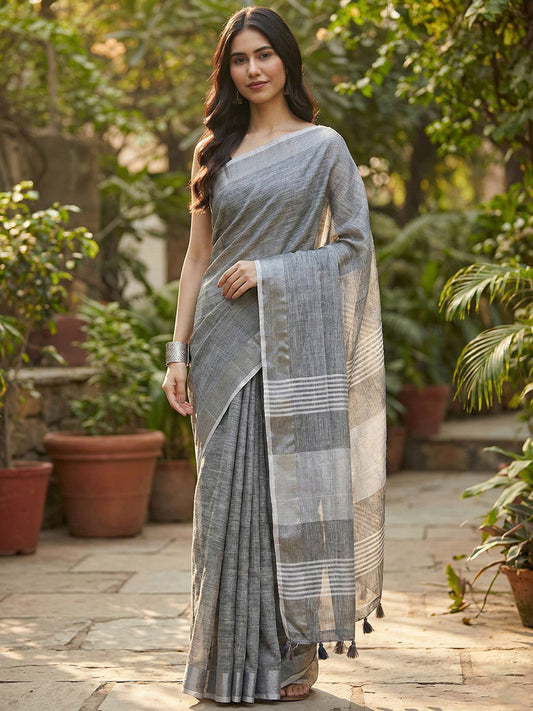 Sutriti Elegant Dark Grey Woven Linen Saree with Contrast Zari Border & Tassels – Soft & Breathable Party Wear