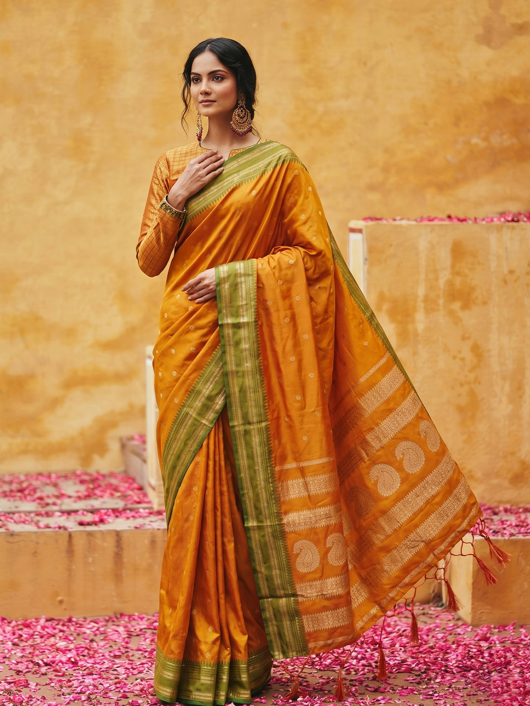 Sutriti The Sunset Glow: Vibrant Orange Soft Silk Saree with Contrast Green Zari Border