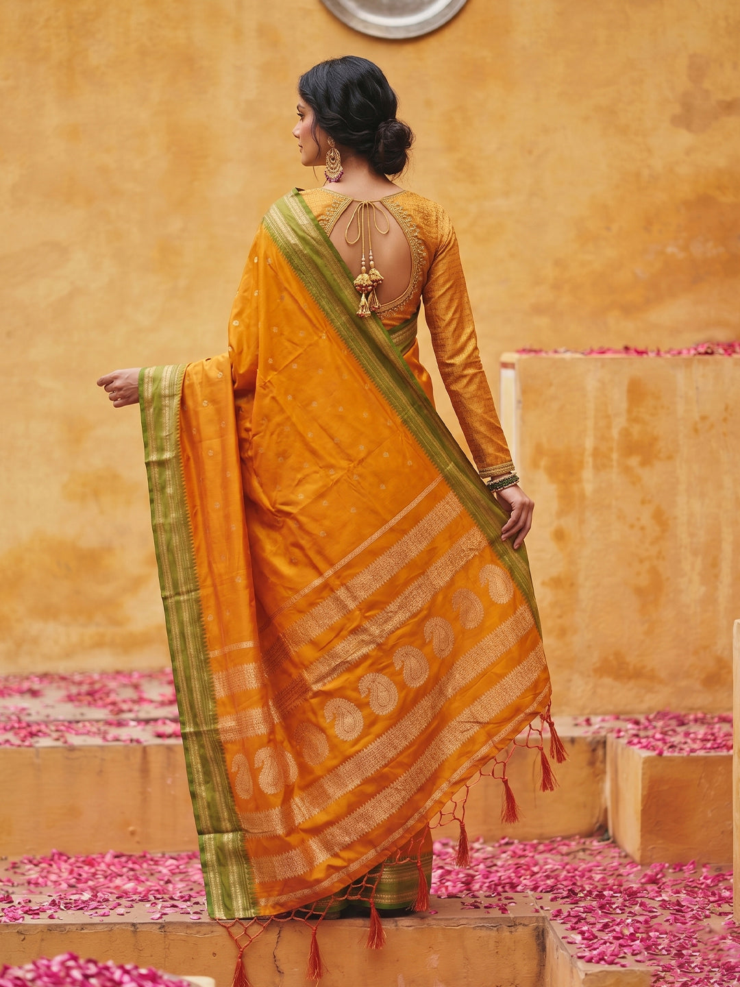 Sutriti The Sunset Glow: Vibrant Orange Soft Silk Saree with Contrast Green Zari Border