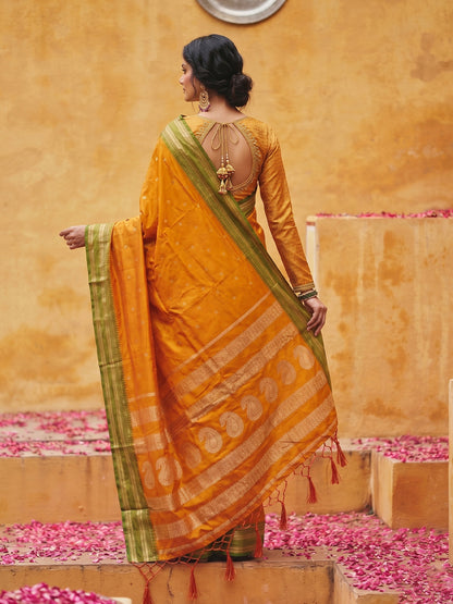 Sutriti The Sunset Glow: Vibrant Orange Soft Silk Saree with Contrast Green Zari Border