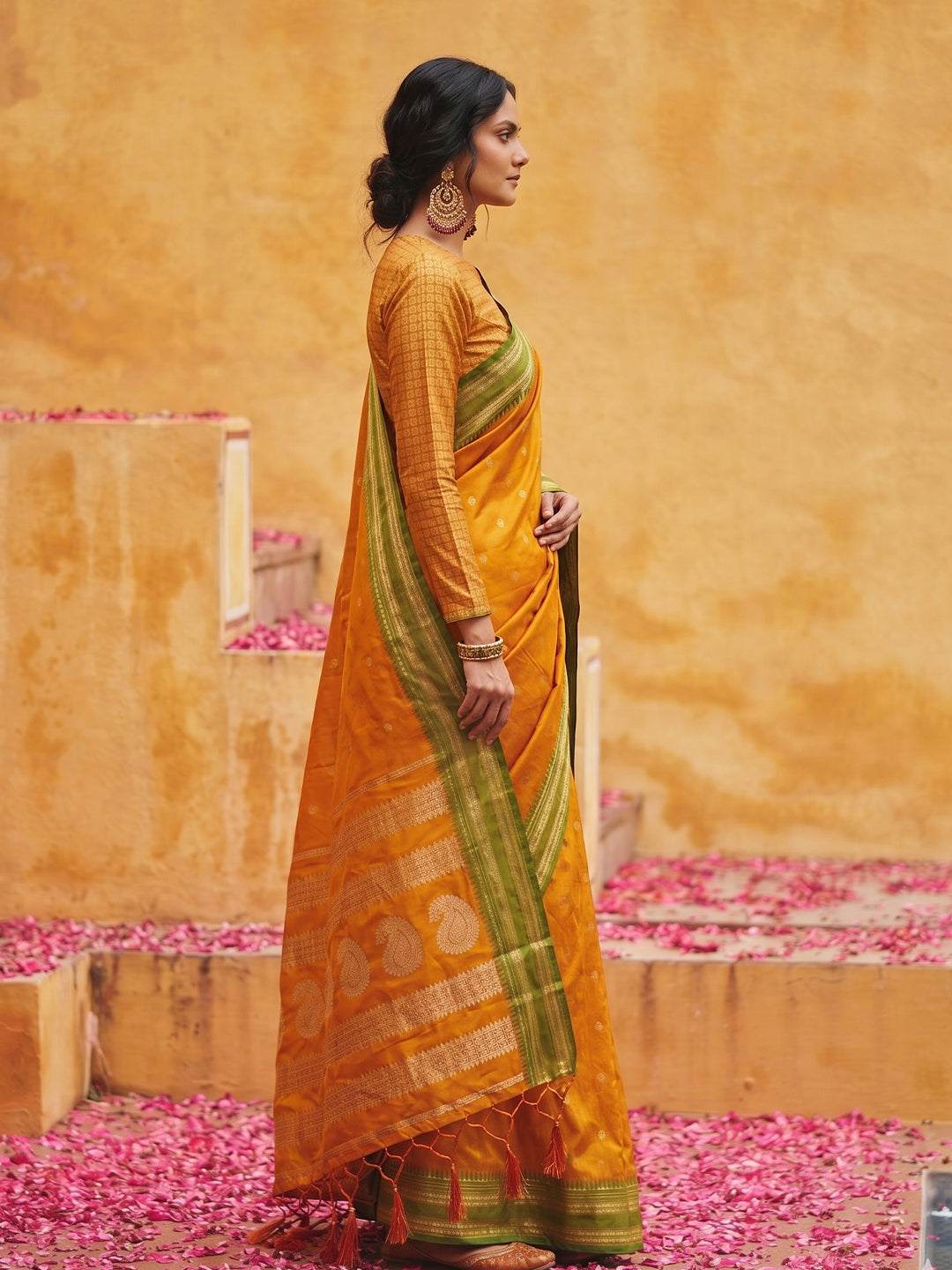 Sutriti The Sunset Glow: Vibrant Orange Soft Silk Saree with Contrast Green Zari Border