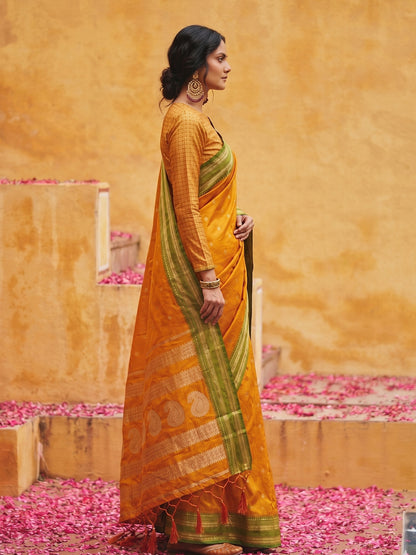 Sutriti The Sunset Glow: Vibrant Orange Soft Silk Saree with Contrast Green Zari Border