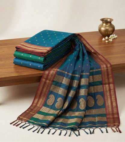 Sutriti The Peacock Hue: Teal Blue Soft Silk Saree with Contrast Red Zari Border