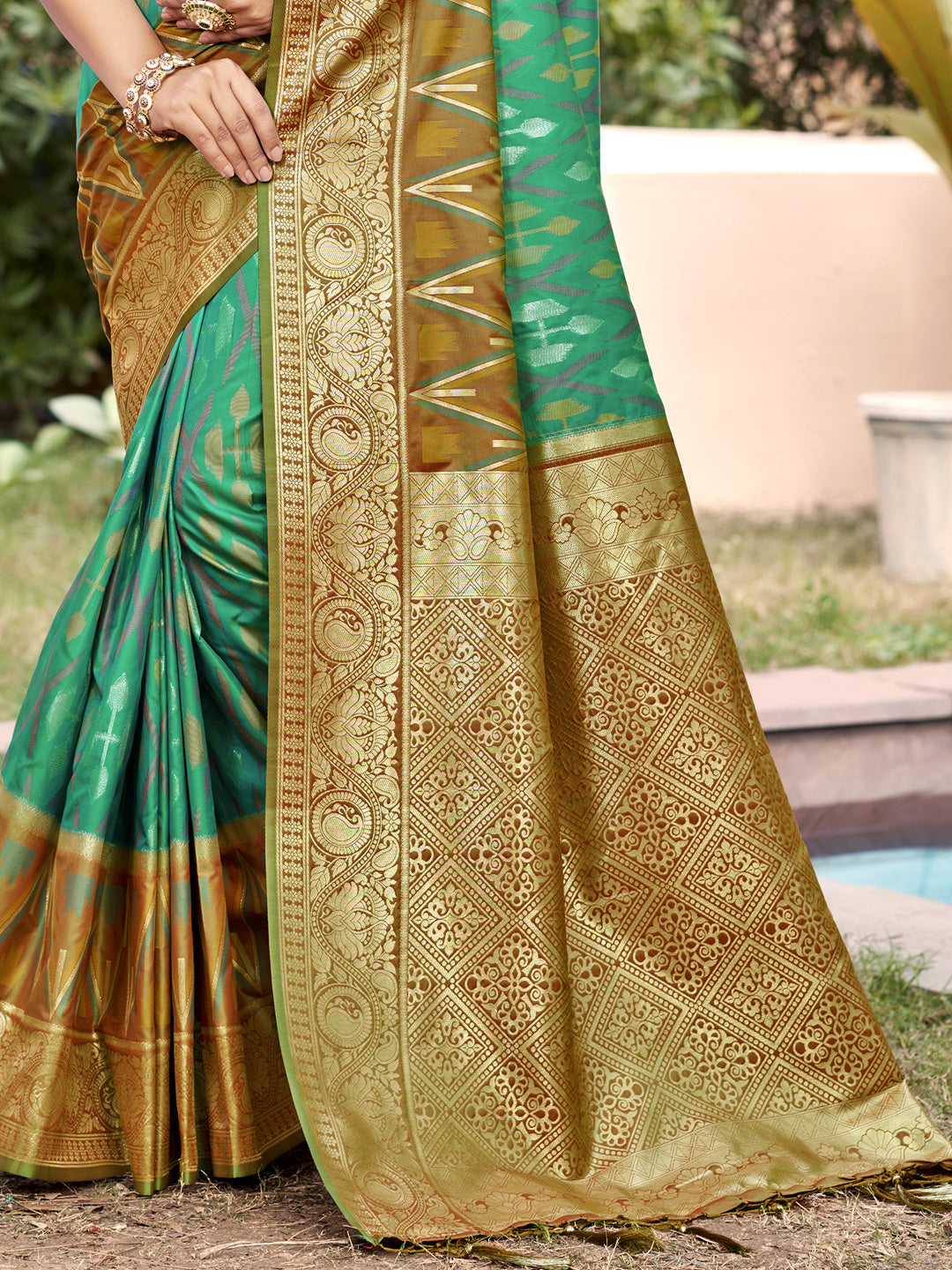 Emerald green woven saree with antique gold border and heavy jacquard pallu for women