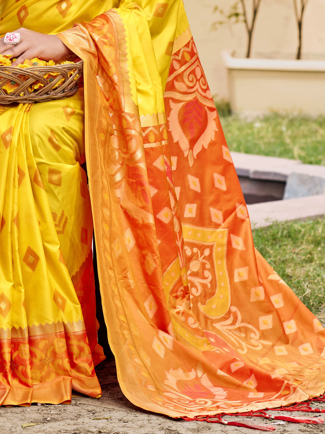 Yellow woven saree for women with orange contrast border and designer pallu for haldi festive wear