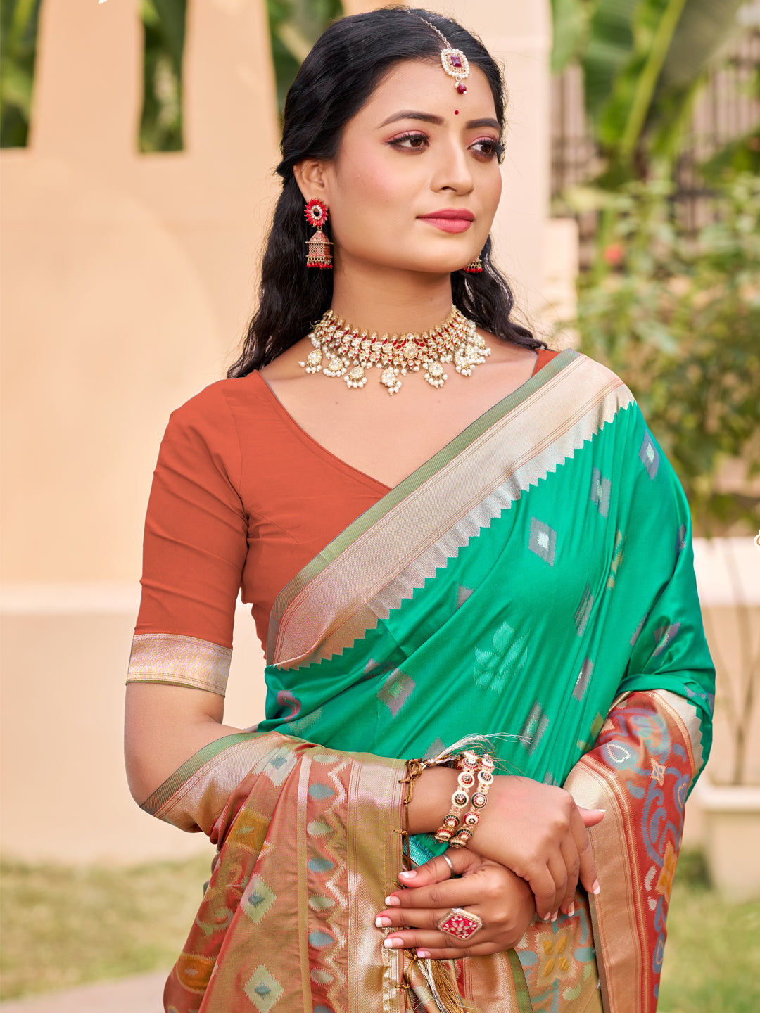Emerald green woven saree for women with brown contrast border and designer pallu