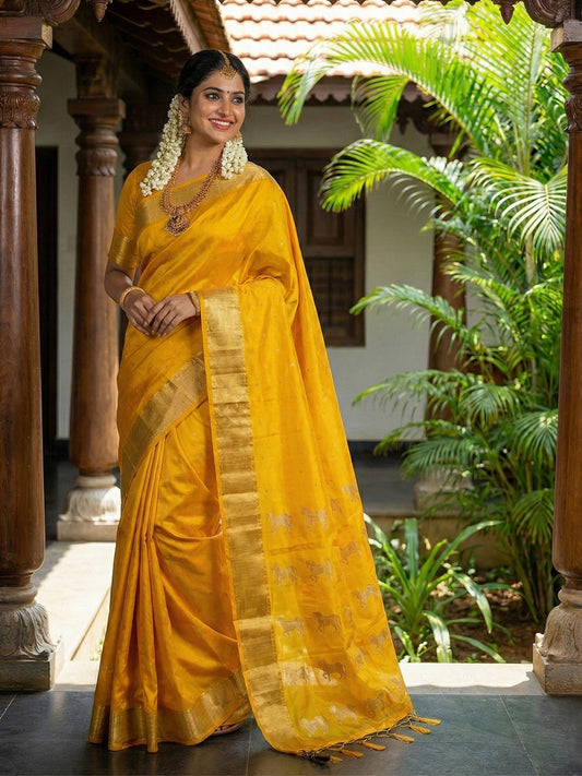 Mustard yellow silk saree with gold zari border and ethnic horse motif