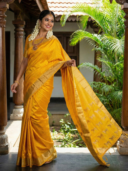 Mustard yellow silk saree with gold zari border and ethnic horse motif