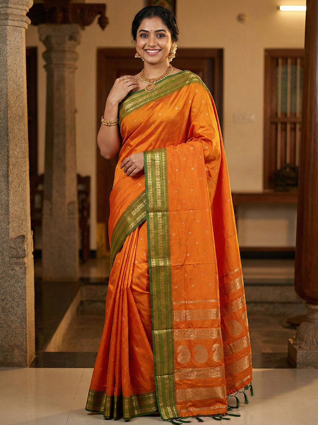 Sutriti The Sunset Glow: Vibrant Orange Soft Silk Saree with Contrast Green Zari Border