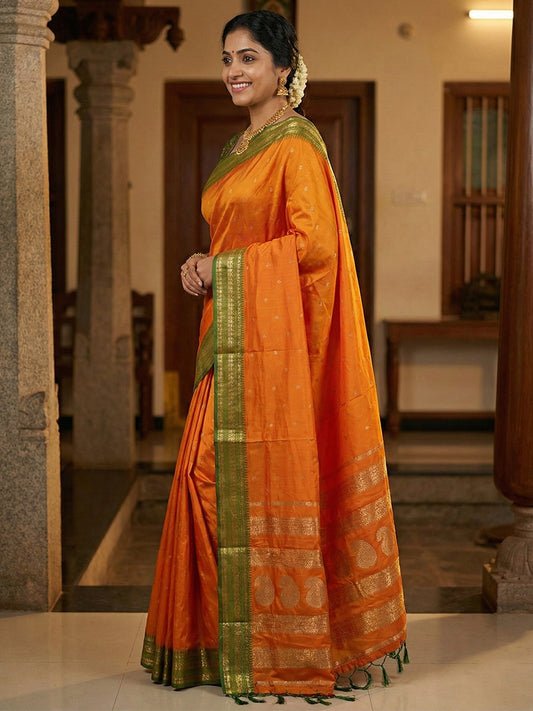 Sutriti The Sunset Glow: Vibrant Orange Soft Silk Saree with Contrast Green Zari Border