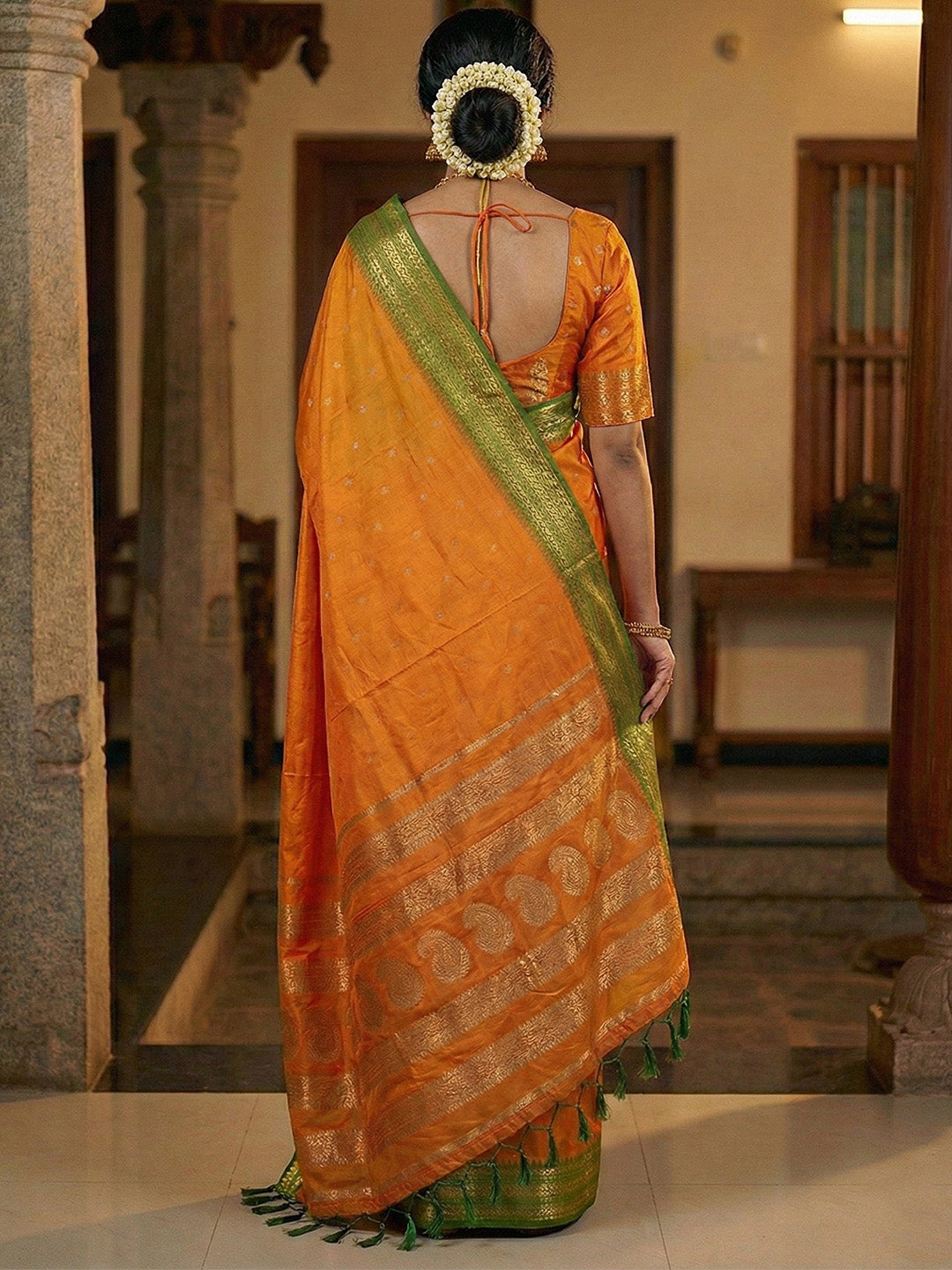Sutriti The Sunset Glow: Vibrant Orange Soft Silk Saree with Contrast Green Zari Border