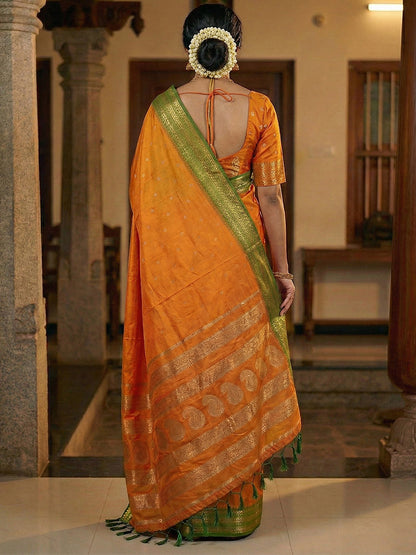 Sutriti The Sunset Glow: Vibrant Orange Soft Silk Saree with Contrast Green Zari Border