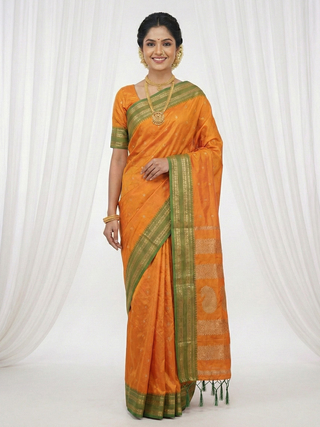 Sutriti The Sunset Glow: Vibrant Orange Soft Silk Saree with Contrast Green Zari Border