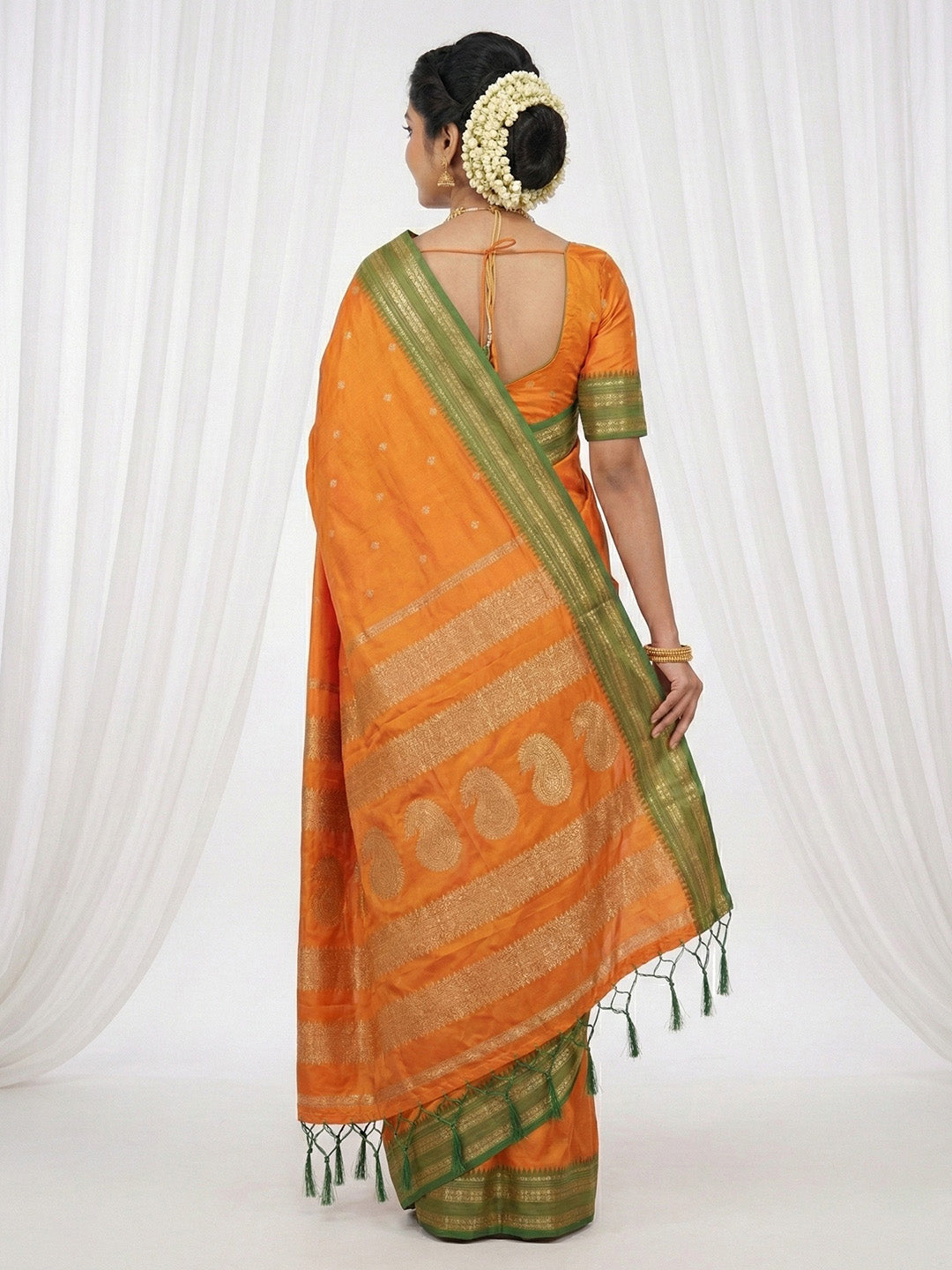 Sutriti The Sunset Glow: Vibrant Orange Soft Silk Saree with Contrast Green Zari Border