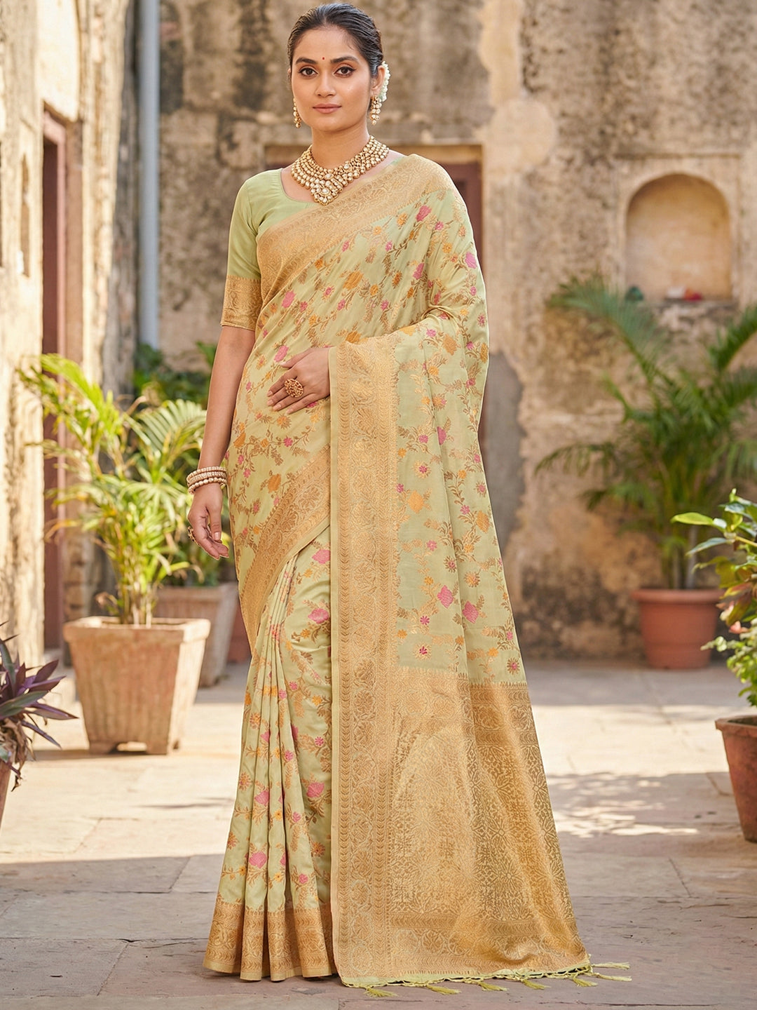 Sutriti Graceful Light Green Banarasi Silk Saree with Golden Zari Woven Border & Floral Jaal – Wedding & Festive Wear