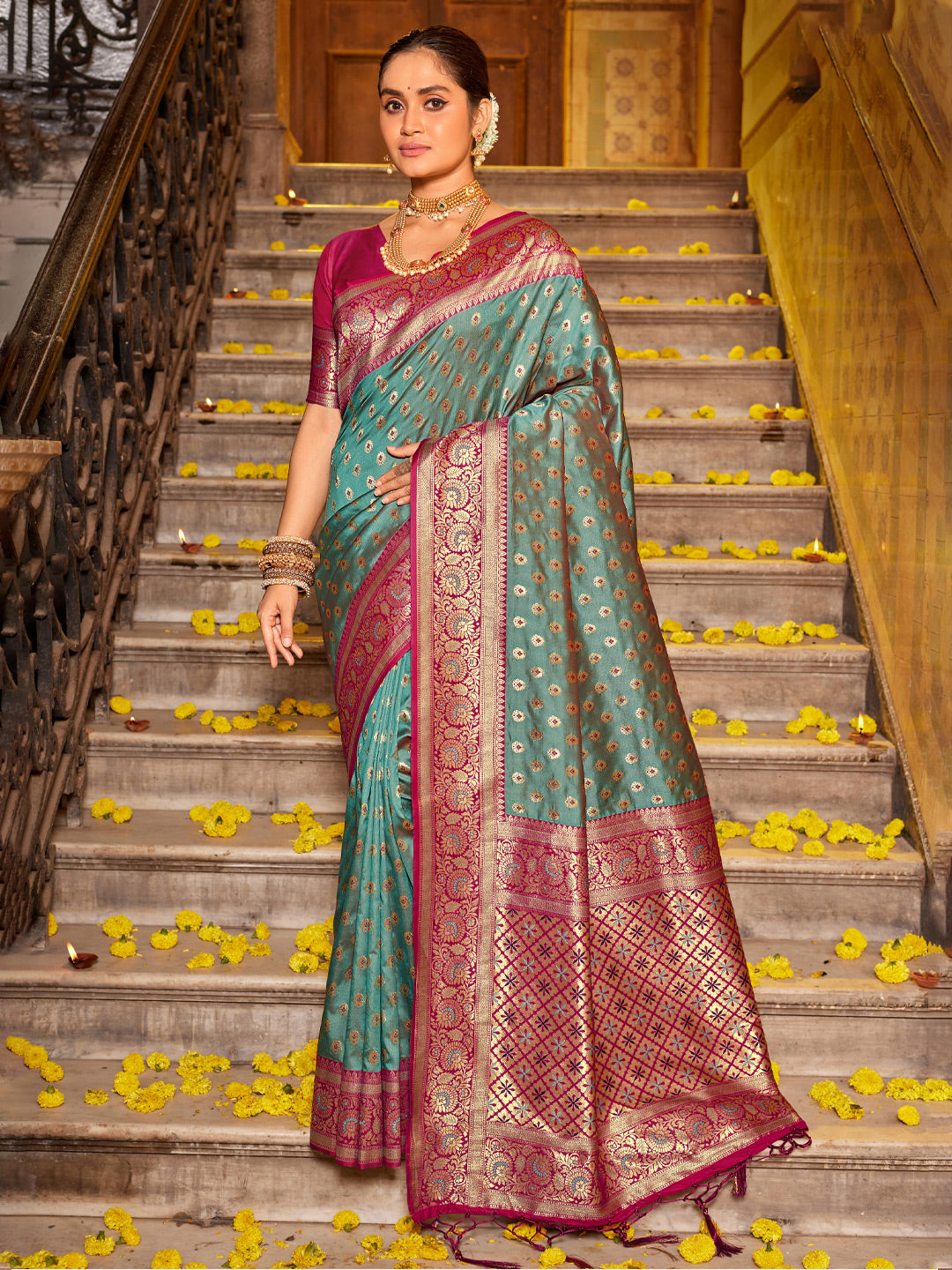Teal green zari woven saree for women with magenta contrast border and rich pallu for wedding festive wear